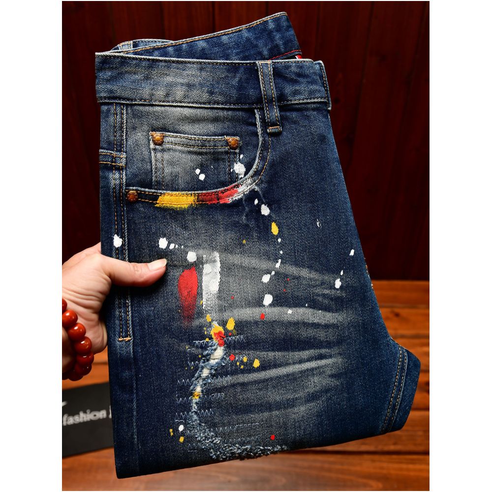 Trendy Korean style men s jeans with ripped patches blue paint spray slim fit American style autumn and winter trousers image 0