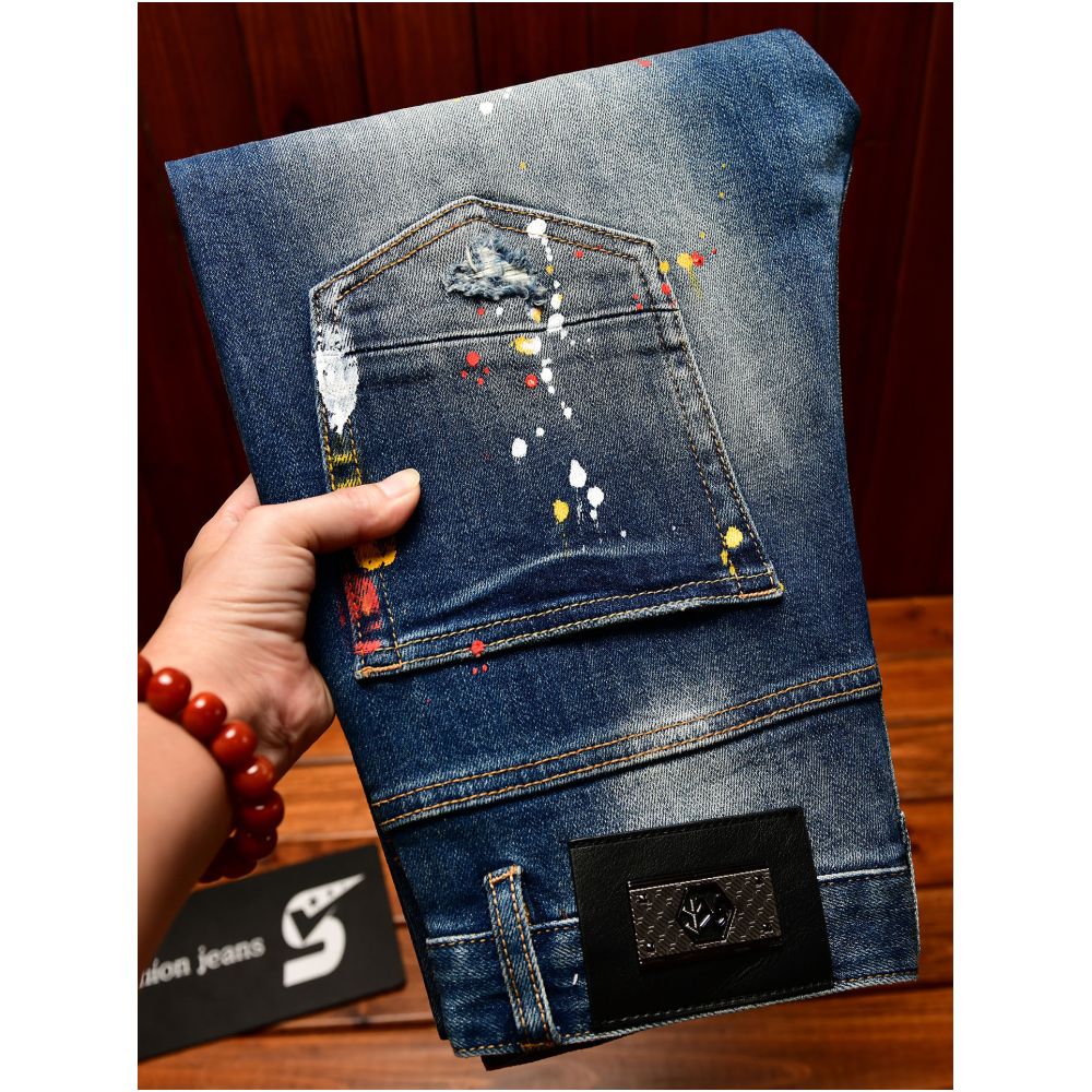 Trendy Korean style men s jeans with ripped patches blue paint spray slim fit American style autumn and winter trousers image 1