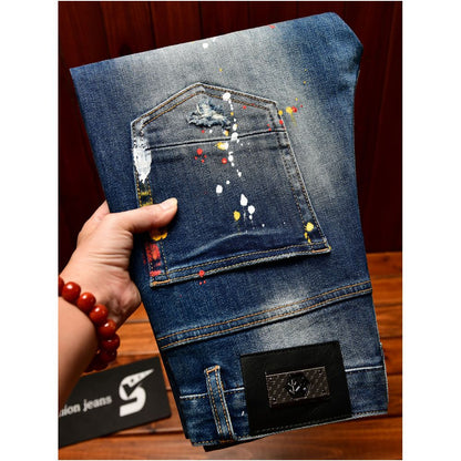 Trendy Korean style men s jeans with ripped patches blue paint spray slim fit American style autumn and winter trousers image 1